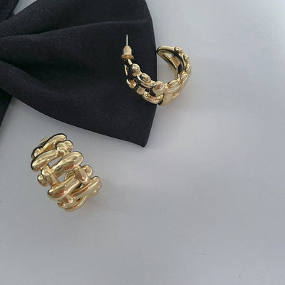 Wide edge twist cutout earring