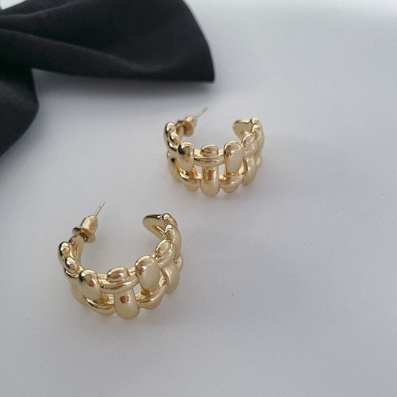 Wide edge twist cutout earring