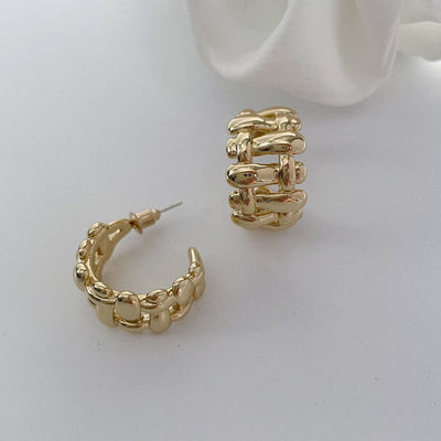 Wide edge twist cutout earring