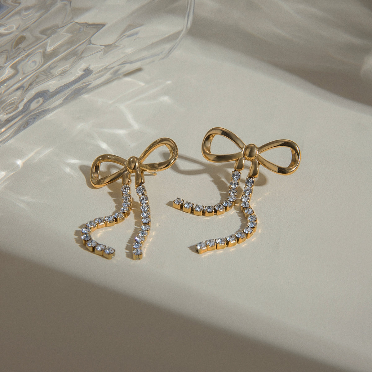 Rhinestone chain earrings with bow