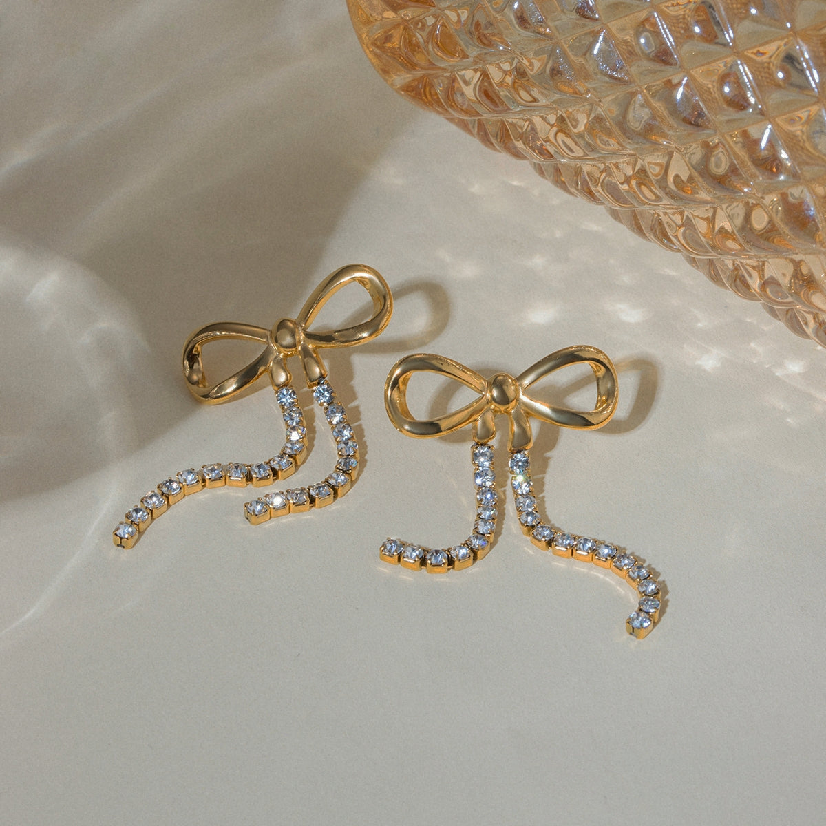 Rhinestone chain earrings with bow